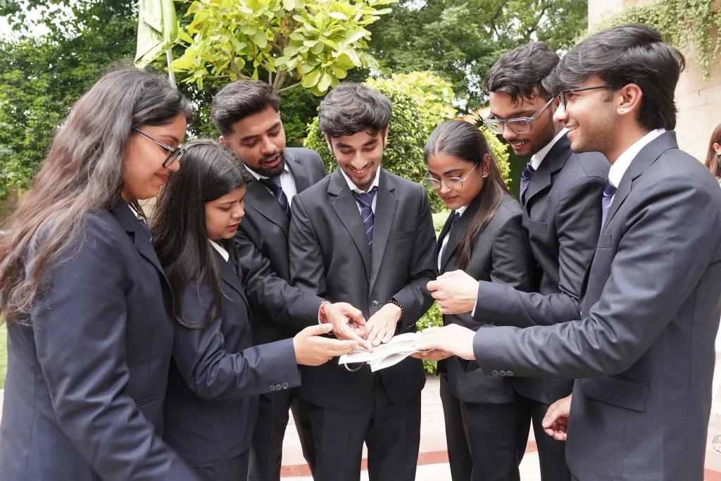 Students presenting a live business case in a JIMS classroom